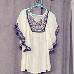 Blouse with black stitch details on chest and sleeves new without tags. Medium